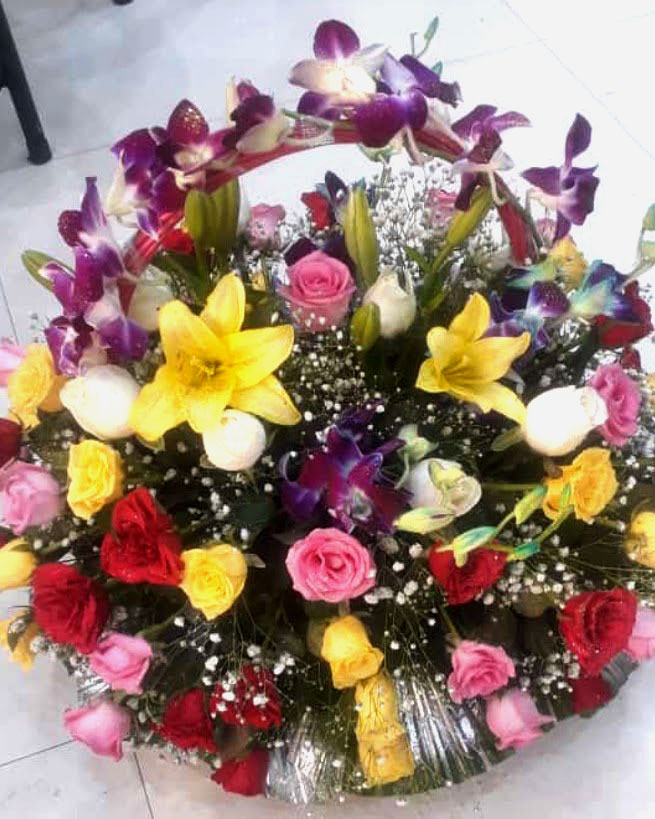 Premium Lily Flowers, Ravel Pink Roses, Violet Orchids & Gypsophila Basket Arrangement