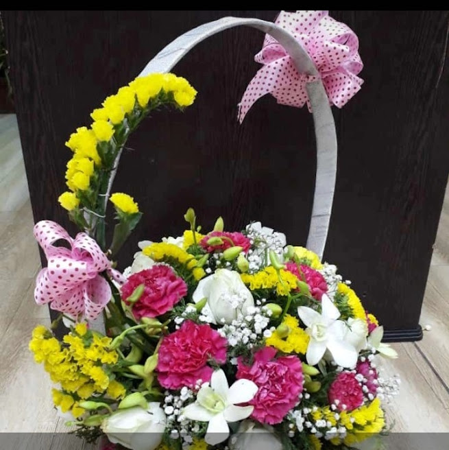 Premium White Orchids, Pink Carnations & Yellow Chrysanthemums Basket Arrangement