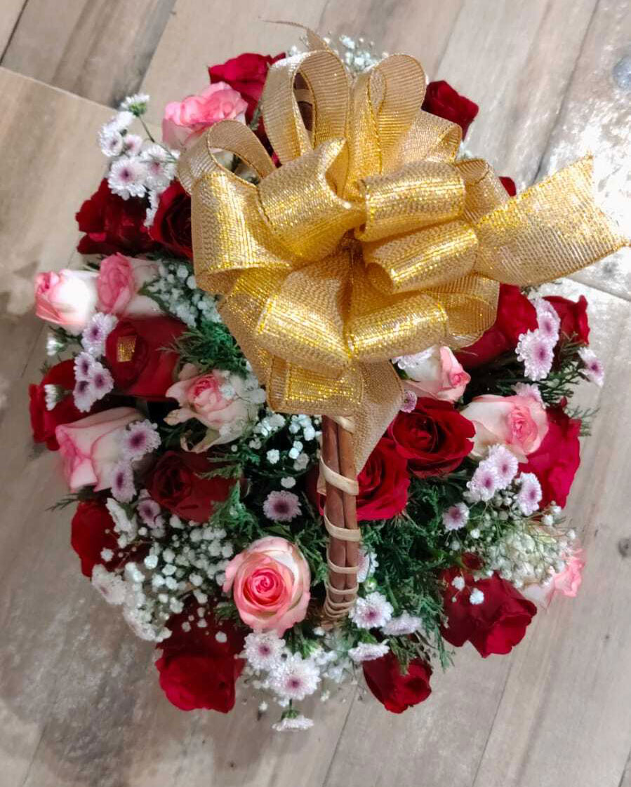 Elegant Red and Pink Roses Basket Arrangement with White Fillers