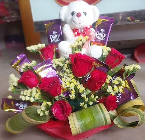 Red Rose Bouquet with Teddy Bear & Dairy Milk Chocolates Basket Arrangement